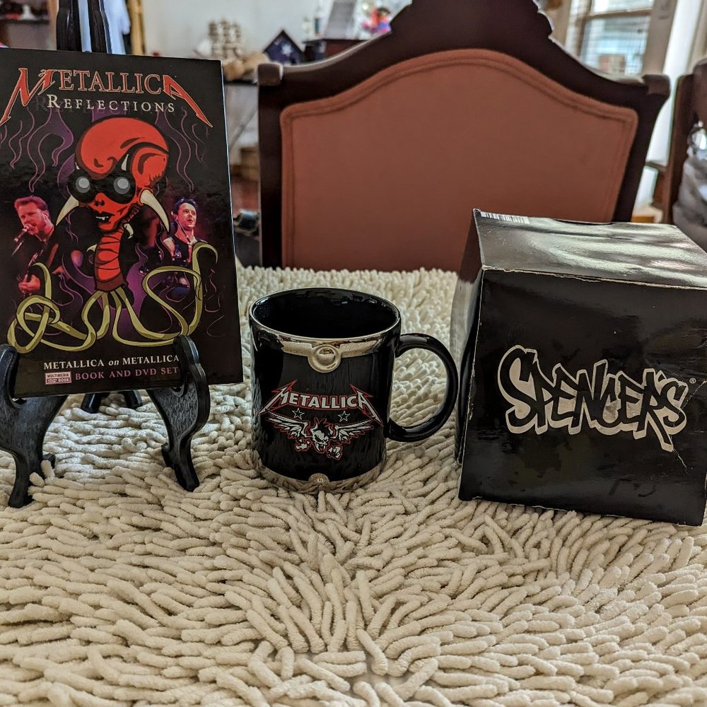 Bundle of two (2) Metallica items.  (Cup & Book/DVD set)